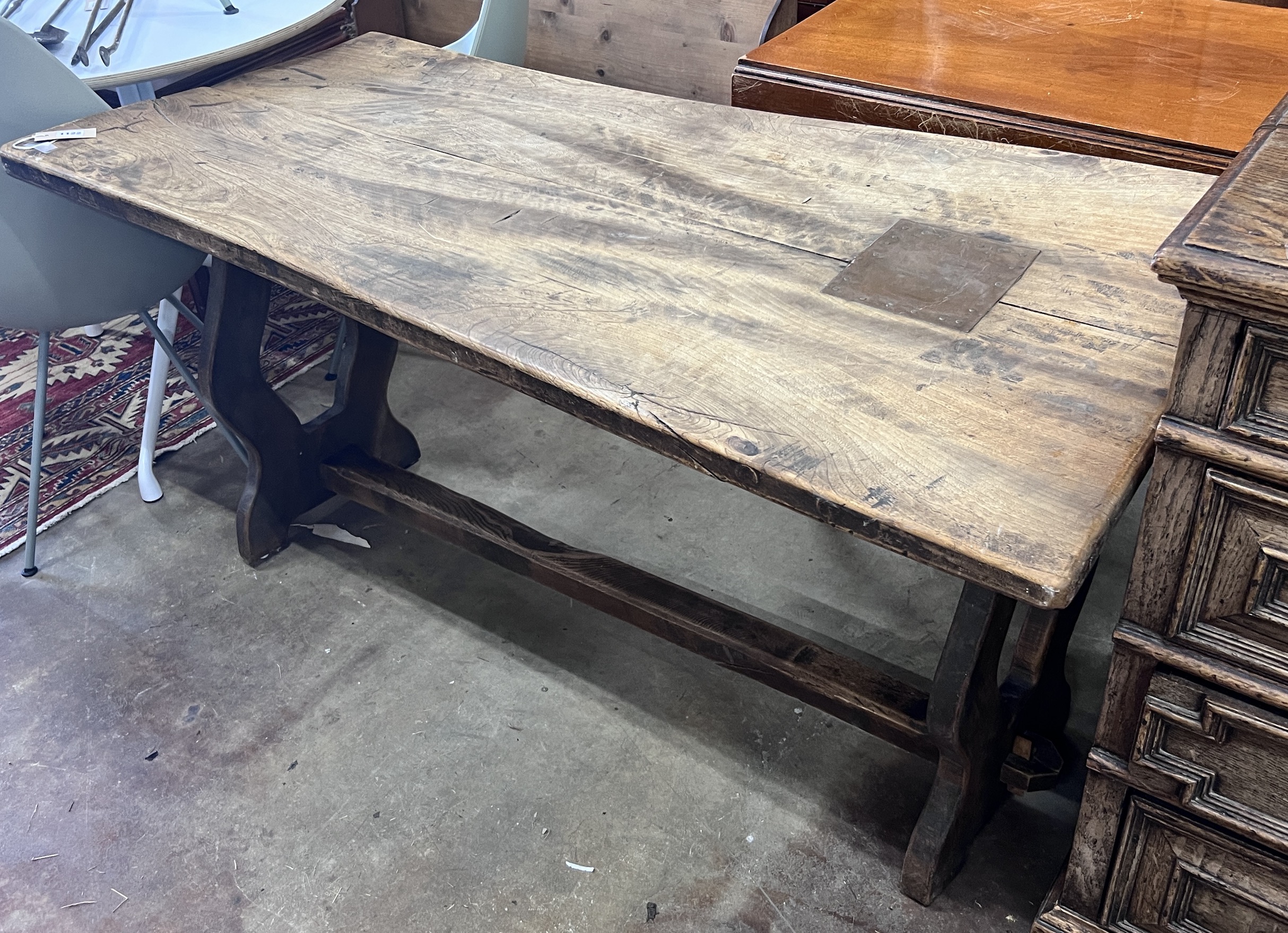 A small 18th century style rectangular elm refectory table, length 137cm, depth 64cm, height 70cm (severely warped)